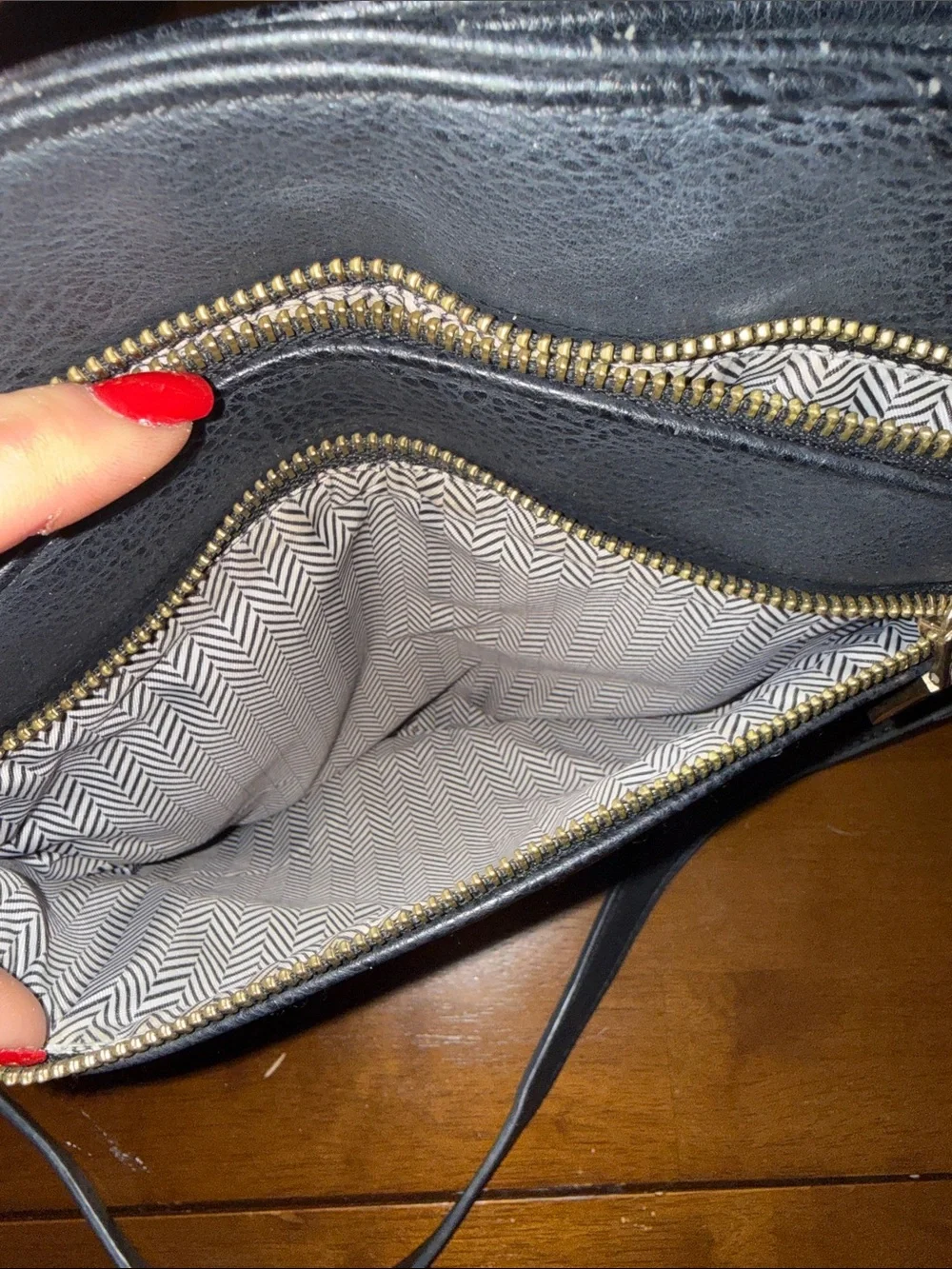 Classic Black Leather Crossbody Bag with Gold Zippers